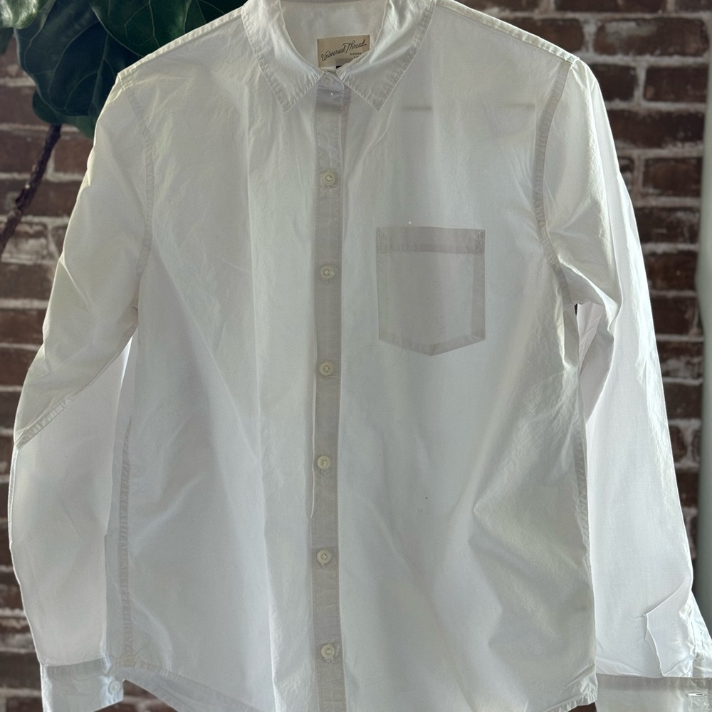 Long sleeved women’s white shirt.